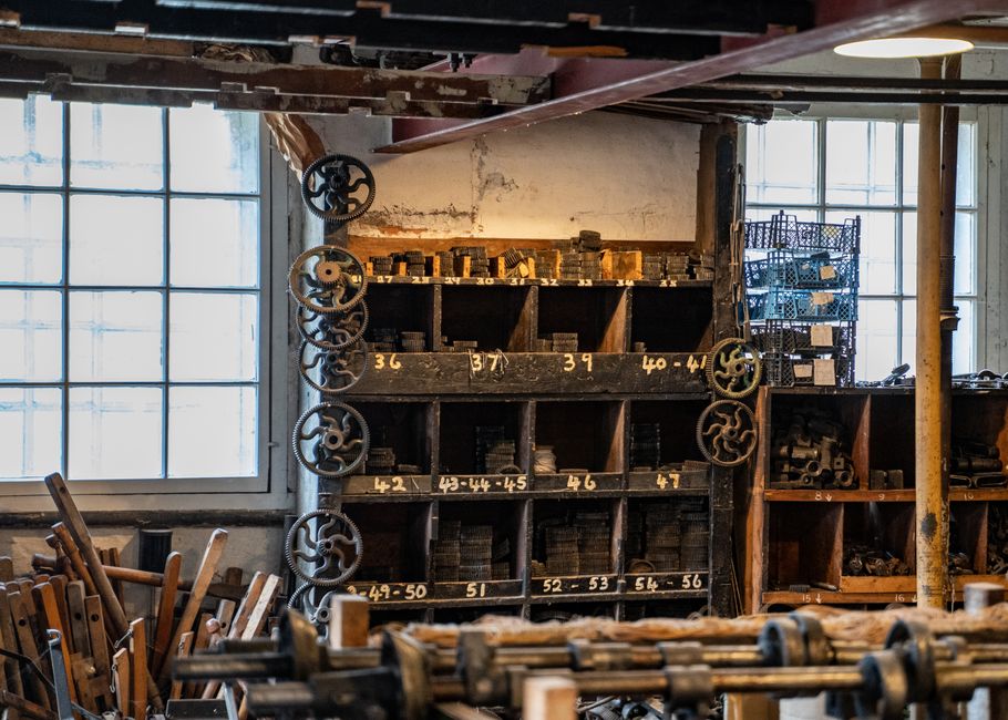 Explore a nostalgic workshop featuring antique shelves filled with hardware and gears.
